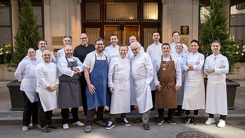 Group of chefs posing outside Restaurant Daniel in New York for Citymeals Sunday Supper