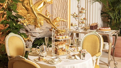 Afternoon tea in London at The Ritz London Palm Court with tiered stands