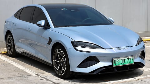 Silver BYD electric sedan parked outdoors showcasing sleek aerodynamic design and EV styling