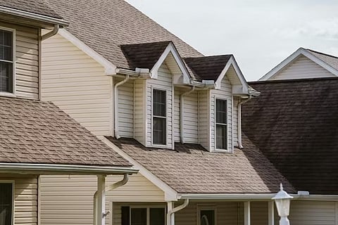 A residential house with a prominent dormer window