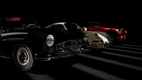 Classic Mercedes-Benz 190 SL, Porsche 911 and vintage race car in dramatic studio lighting
