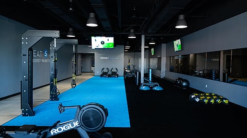 Interior of a SWEAT440 fitness studio with turf training floor