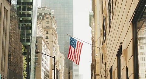 A moment in time featuring a US flag waving in New York City