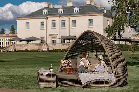 Guests enjoying a picnic on the lawn at The Langley in Buckinghamshire near London