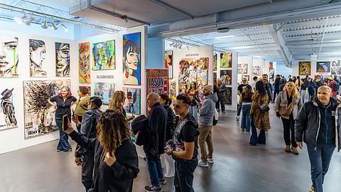 Visitors explore contemporary artworks and gallery booths at Artexpo New York