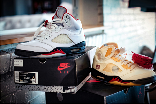 A side-by-side comparison of Nike 'Fire Red' (2020) and the Off-White x Air Jordan 5 Retro 'Sail'