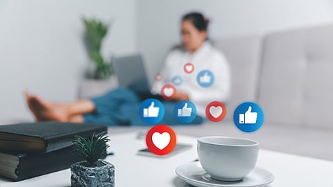 Person using laptop at home with social media icons overlay representing private browsing behavior