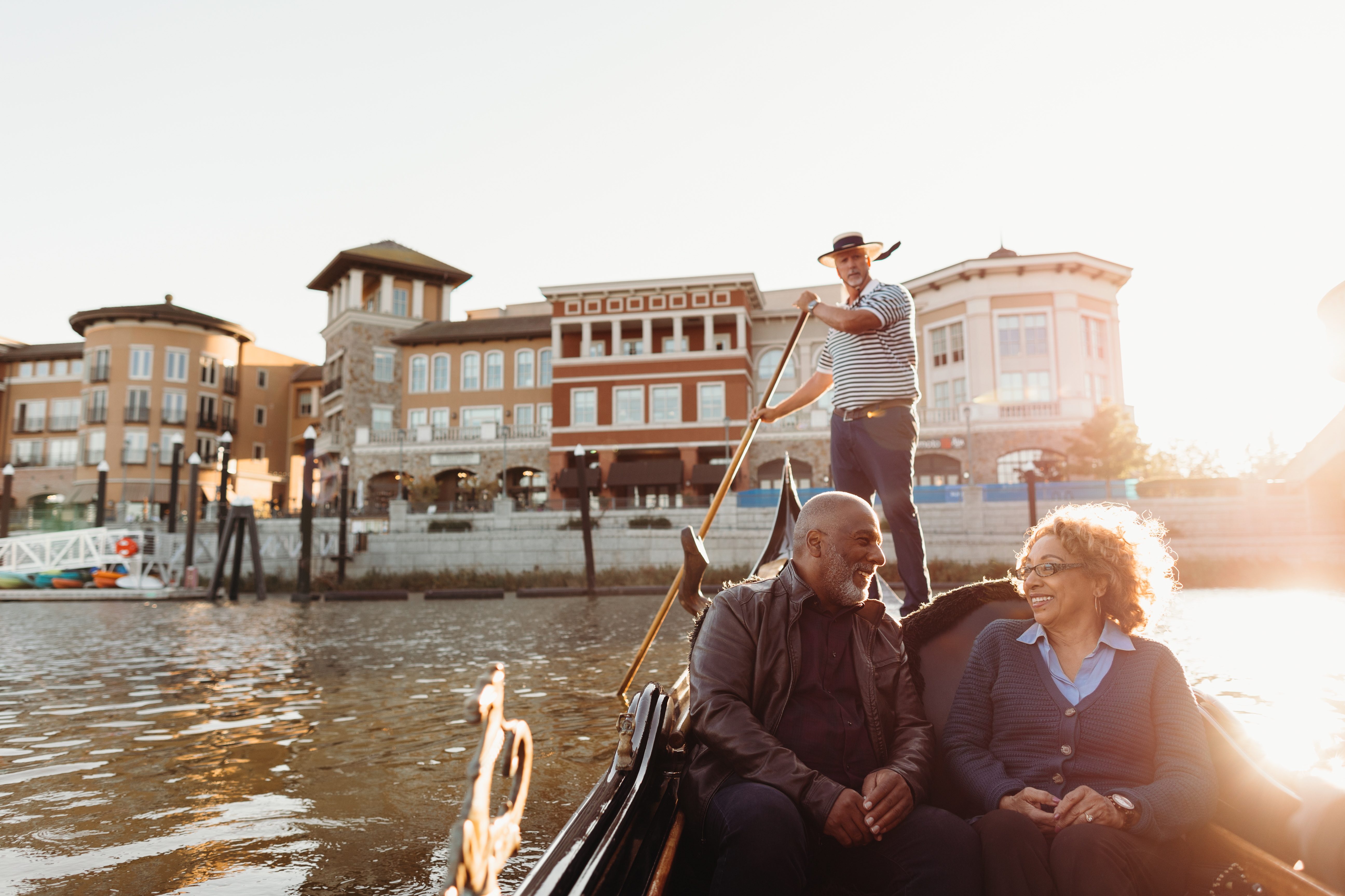 Couple enjoying a gondola ride on the Napa River at sunset