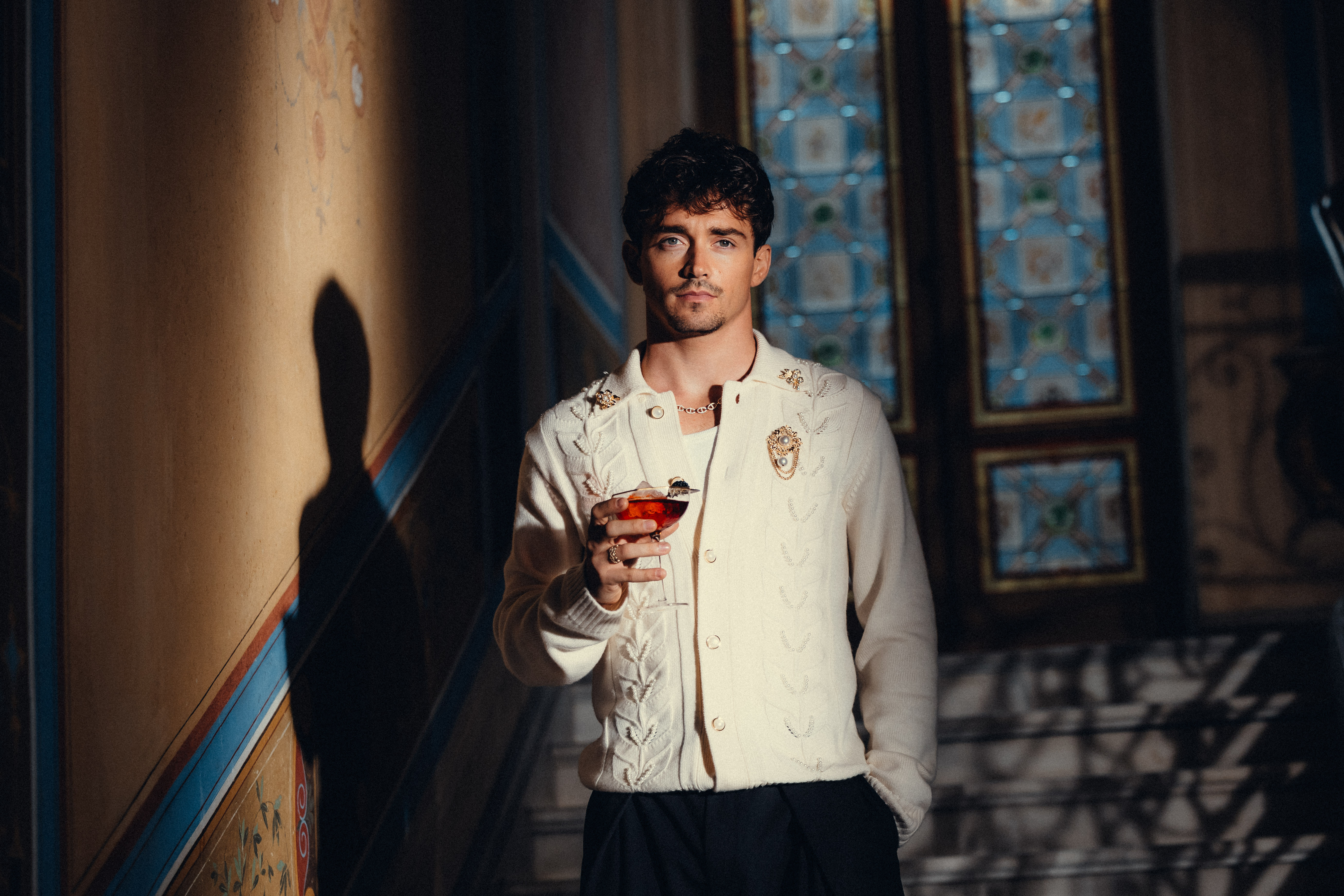 Charles Leclerc with Chivas Regal 16 cocktail in ornate interior setting