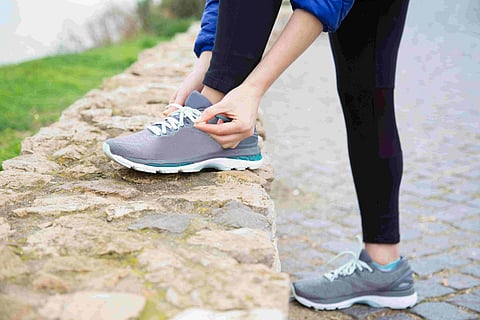 comfortable Ryka Women's walking sneakers with lace-up closures and responsive cushioning