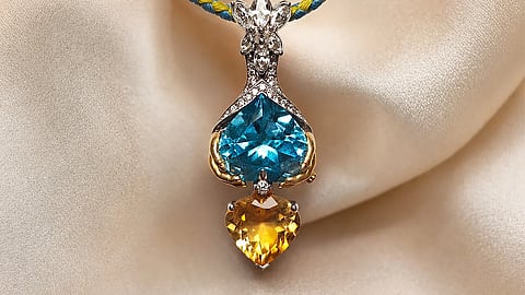 Blue and yellow gemstone pendant with diamond accents inspired by a Ukrainian family reunion