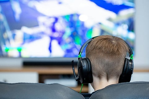 a child engaged in gaming