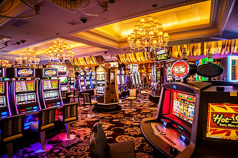 a crowded casino floor filled with numerous slot machines