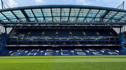 Wide view of Stamford Bridge football pitch and stadium seating