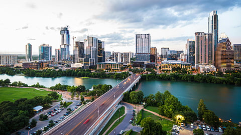 Houston skyline at sunset with bridge and river views