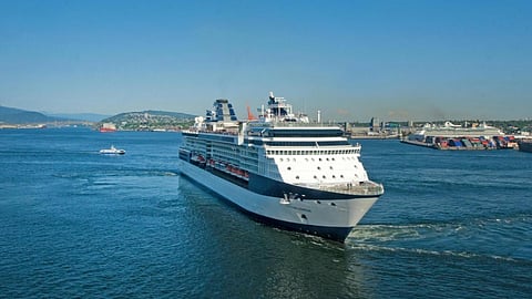 Luxury cruise ship sailing across open water with onboard casino and entertainment experiences