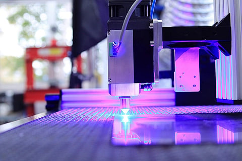 an industrial laser cutter utilizing a blue diode laser head for precise material processing
