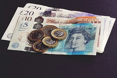 a collection of British Pound Sterling banknotes