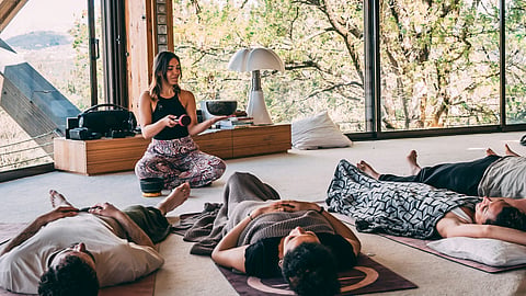 Guests relax during a guided wellness and integration session at a Dutch retreat center