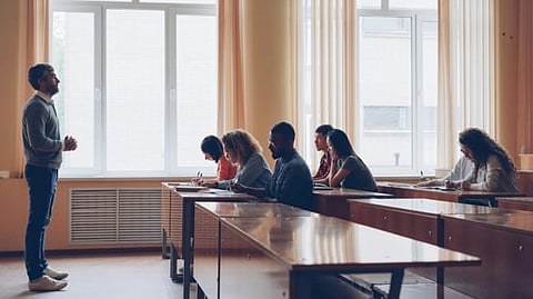a professor conducting a lecture for a diverse group of students