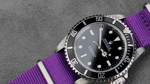 Rolex Submariner is paired with a vibrant purple nylon NATO strap