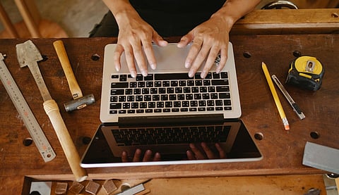 a girl working on a laptop