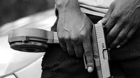 Firearms in a person's hand
