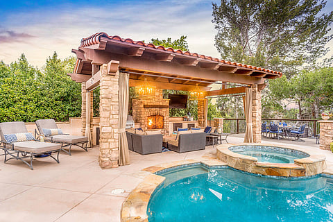 a luxury pool side view of a hotel