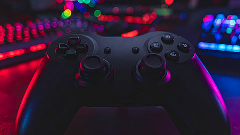 Gaming controller with RGB lighting in an esports gaming setup