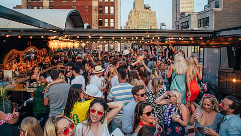 Fans gather at Magic Hour Rooftop for an NBA Finals watch party in Midtown Manhattan