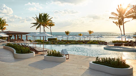 Resort pool overlooking the Caribbean Sea at Rosewood Mayakoba Riviera Maya