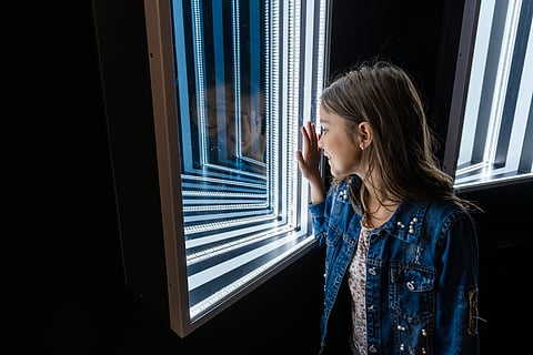 Visitors inside the Symmetry Room at Paradox Museum Miami in Wynwood