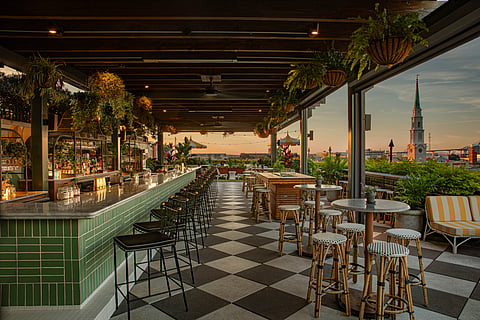 Rooftop pool and bar at Perry Lane Hotel overlooking the Savannah, Georgia skyline
