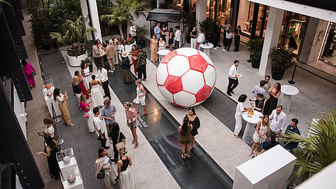 Guests explore the 12 Pentagons installation in the Center Courtyard at Bal Harbour Shops