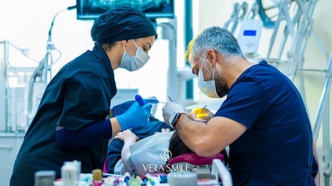 dentists performing dental surgery 