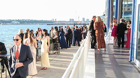 Guests mingle on the Pier Sixty waterfront terrace during the gala
