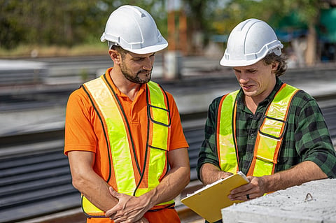 two contractors discussing a project