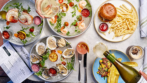 Seafood platters, cocktails, burgers, and oysters served at News Cafe Miami Beach