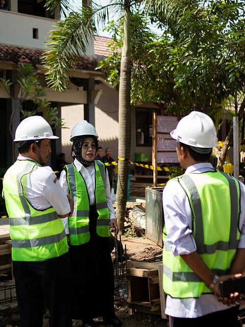 construction professionals discussing project plans on-site