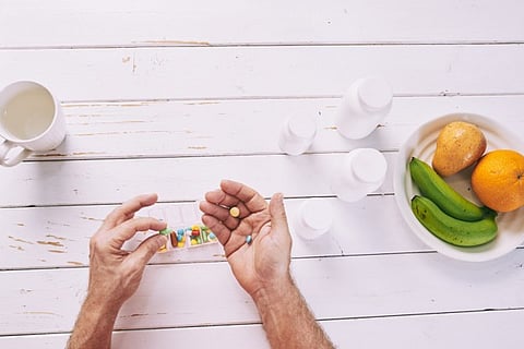 a person taking supplements