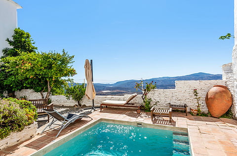 Private villa terrace in Granada overlooking a beautiful view with clear sky.