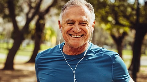 Older adult jogging outdoors as part of a healthy aging and longevity lifestyle