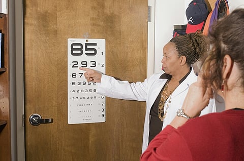 a healthcare professional conducting an eye examination