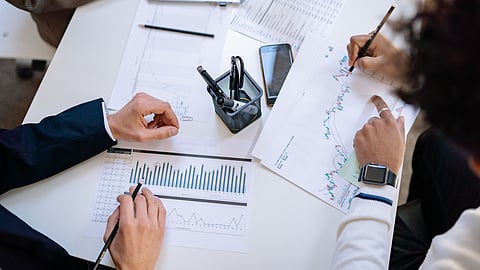 Business professionals review market data and analytics for regulated online gambling growth