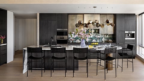 Luxury kitchen with bespoke leather counter stools and marble island
