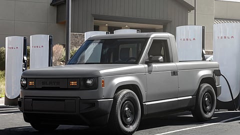 Slate Auto electric pickup charging at an EV station