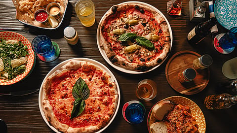 Neapolitan pizzas, pasta, calamari, and salad served at Giotto in Downtown Miami