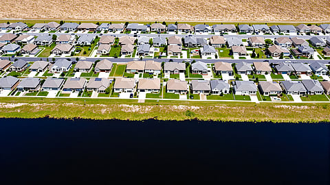 Aerial view of an Orlando master-planned community with lakes and new homes