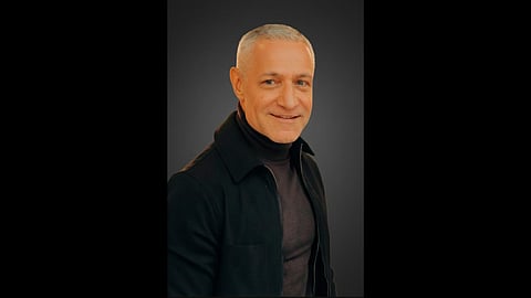 Michael Yormark, president of Roc Nation Sports International, seated in a navy suit