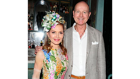 Jean Shafiroff in a floral dress beside Prince Dmitri of Yugoslavia